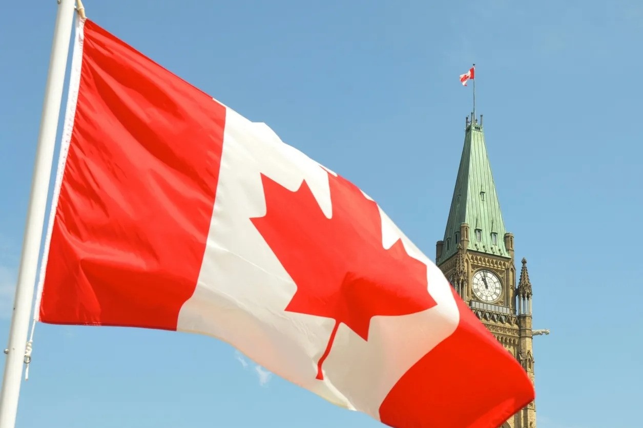 Canadian flag in front of Parliament